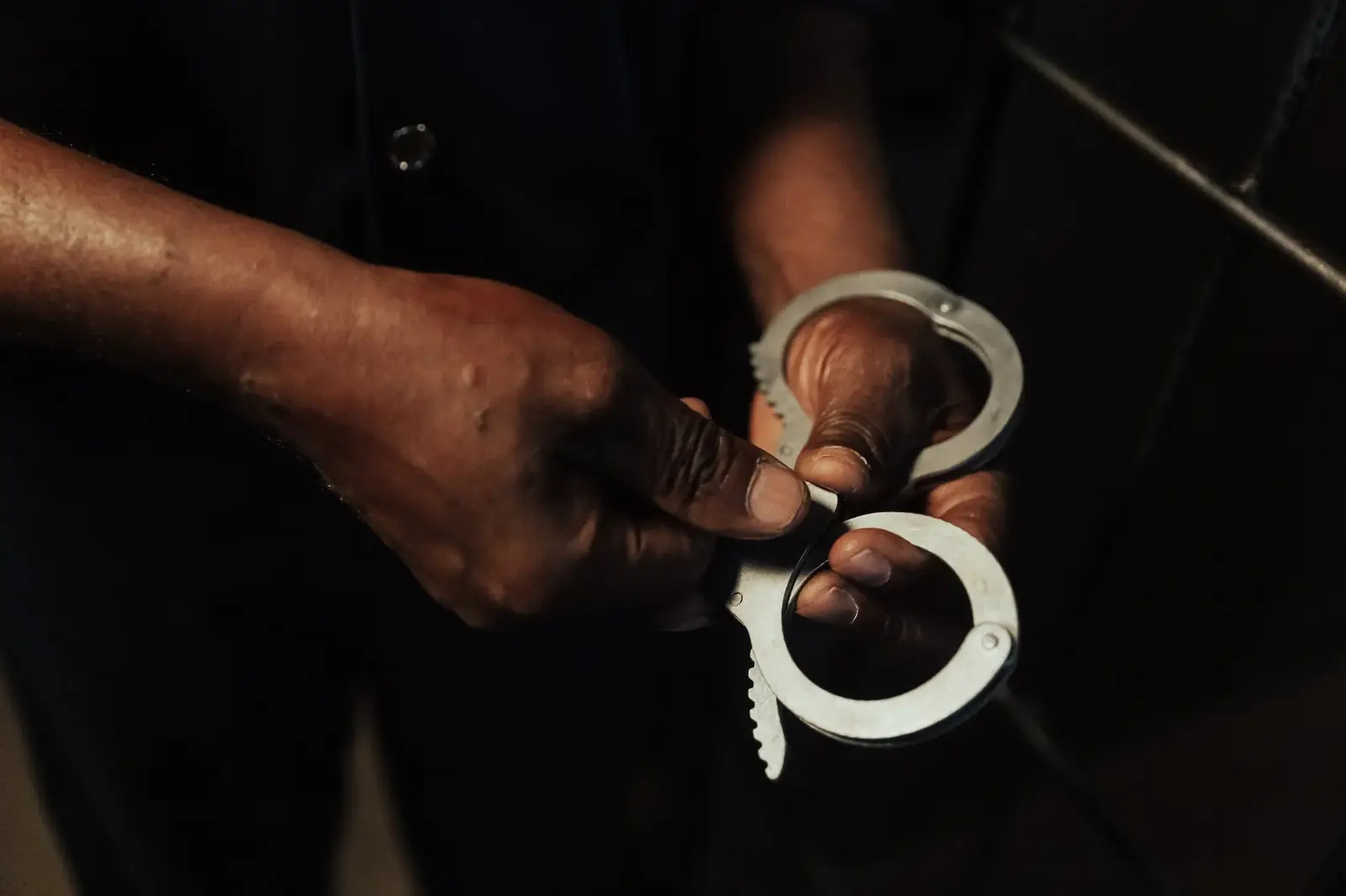 Close view of handcuffs being opened
