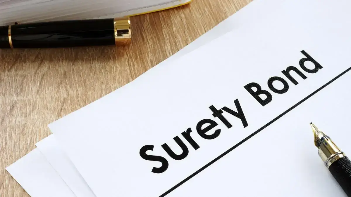 Surety bond document with a fountain pen